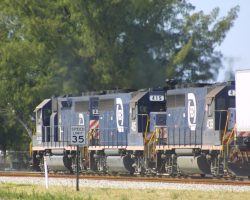 Only the Key West extension perhaps could be considered a folly - the rest of Flagler's Florida East Coast is a cutting-edge modern regional railroad. FEC 448, 415, and 439 run north with a mixed on 5-May-2002 near Lake Park, FL.