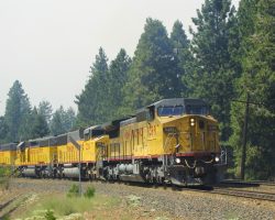 About 20 minutes after 9391 passed through westbound, UP 9399 leads one up the hill at Alta. The smoke is really starting to become noticable now in the background, with the previously blue skies now completely obscured.
