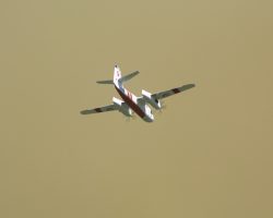 One of CDF's aircraft carrying that red flame-retardant goo to the fire. Yes, that's the real color of the sky, I didn't modify it at all.