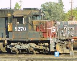 Roseville, once one of the great bastions of SP motive power, has now turned into their graveyard. SP 8270, an SD40T-2, sits outside the shops, presumably waiting to become a parts donor to a running unit or worse, soup cans.