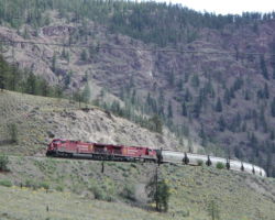 High up on the canyon wall, CP 9512 leads another eastbound.