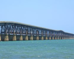 The decking on top is highway decking for the old Overseas Highway (now abandoned). Note the "hump" in the middle where the highway goes up to clear the large center channel span.
