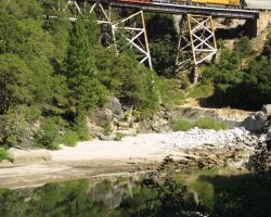 After meeting a Z at Camp Rodgers, this westbound grain train (lead by UP 6335) works downhill across Rock Creek Trestle, halfway between Storrie and Merlin.