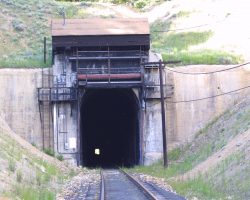 ...and the east side. Yes, I drove over the top, I didn't come through the tunnel. I'm only dumb, not stupid... However, there is a large boulder (or some such obstruction) on the west wall of the tunnel, based on shadows in the light from the west portal. It looks the size of a large sofa or perhaps a small compact car, and about 2/3 of the way down.