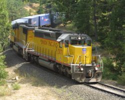 With the work orders lifted, traffic begins to flow again. Seen here going west for a few hundred yards, 3071 leads an eastbound Z around Williams Loop, just west of Quincy.