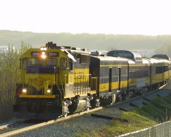 ARR 3011 leads the southbound Coastal Classic, the daily Anchorage-Seward train, just southwest of downtown Anchorage on 21-May-2002.