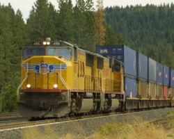 With the two eastbounds out of the way, UP 4168 heads out onto the main at Sloat.