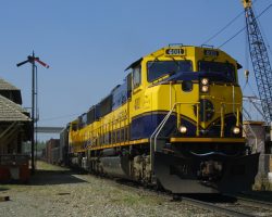 ARR 4011 and 4009 lead a string of mixed freight and empty oil tanks north towards Fairbanks at Nenena, AK, on 24-May.