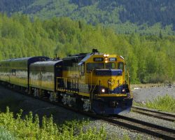 Clear of the meet and north switch lined correctly, 3015 accelerates out of Indian for Anchorage.