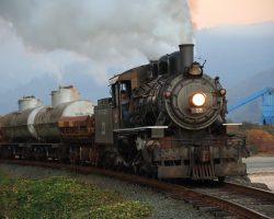 MCRR 25 pulls out of Garibaldi in the late evening, with the sawmill in the background