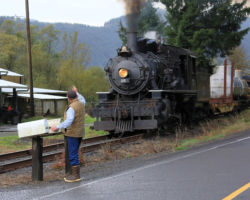The rancher gives our photo special a wave as 25 passes the Nehalem River Ranch.