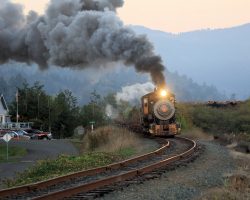 In a scene that was repeated thousands of times in logging towns throughout the west, Polson Lumber #2 heads out of town with a cut of empty log cars.