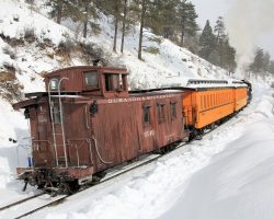 I just like the caboose in the snow. You can see how much snow the flanger removed from the track.