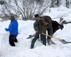 To give you some idea how deep the snow was at many of the spots, here's some of the railroad employees and volunteers digging out a photo line.