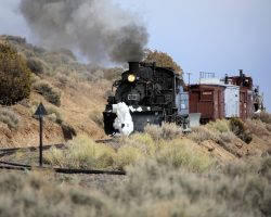 Having gone back through Big Horn and turned around, our special heads downgrade through the Whiplash Curves between mileposts 296-297.