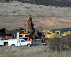 Just a little more! Pulling over a derailed, but upright, car...