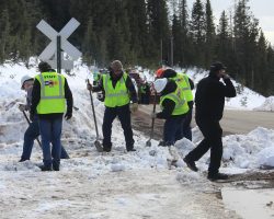 Well, this isn't good. The C&TS guys dig down to find it's nothing but solid ice in the flanges and over the rails from the snow piled up by CDOT.