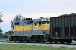 During harvest, the railroad runs 24/7 to bring cane in from the fields. Here, GP11 310 pulls loads in from somewhere west of Clewiston at dusk.