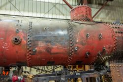 The boiler shell, showing where the flat spot was from the 1943 wreck (white marker outline) and the new upper second boiler course welded and riveted into place. September 20, 2014